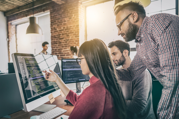 group of people reviewing code